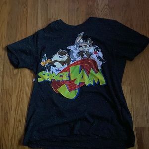 This tshirt is a size large and it has colorful pieces of lint on it